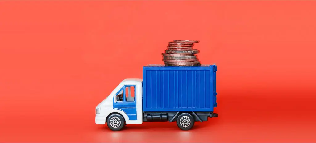 caminhão-carregando-container-com-moedas-em-cima-simbolizando-a-demurrage